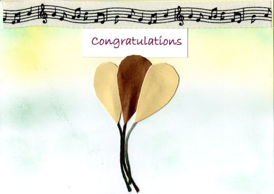 Three balllons with a 'Congratulations' text on a soft background
